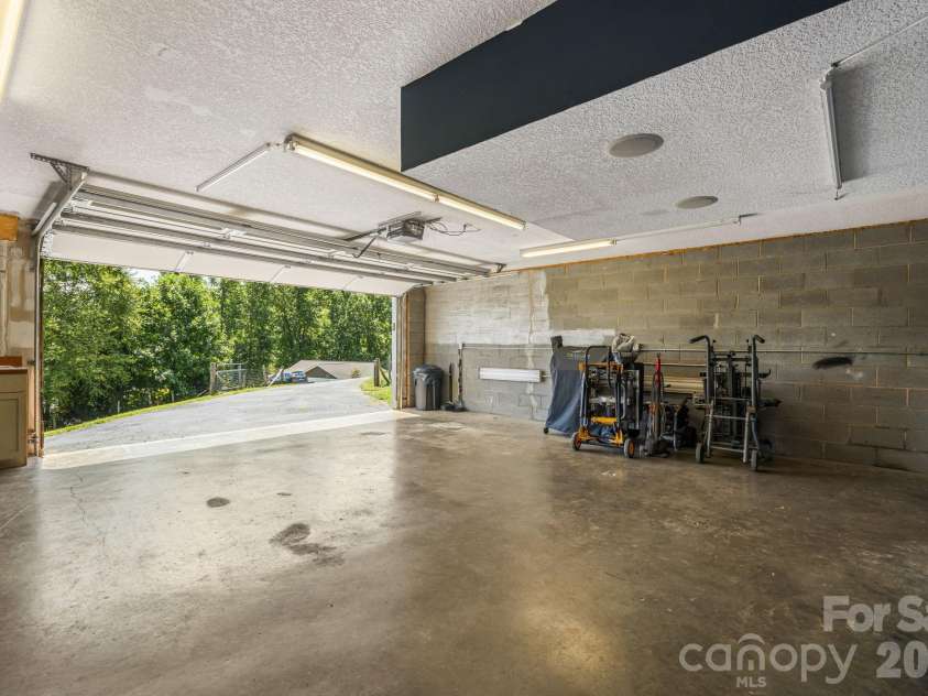 184 Scarlett Ridge Drive, Marshall, NC 28753.  MLS# CAR4416325, YatesRealty ID 47997. 2 car garage with additional storage areas