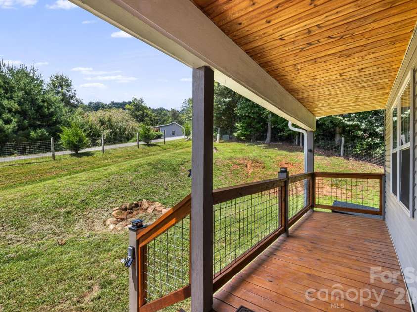 184 Scarlett Ridge Drive, Marshall, NC 28753.  MLS# CAR4416325, YatesRealty ID 47997. Front porch looking right