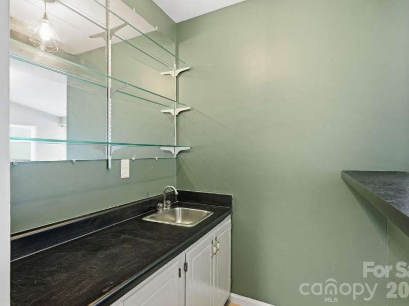 326 Vista Grande Circle, Charlotte, NC 28226.  MLS# CAR4418981, YatesRealty ID 48012. Wetbar feels retro and practical