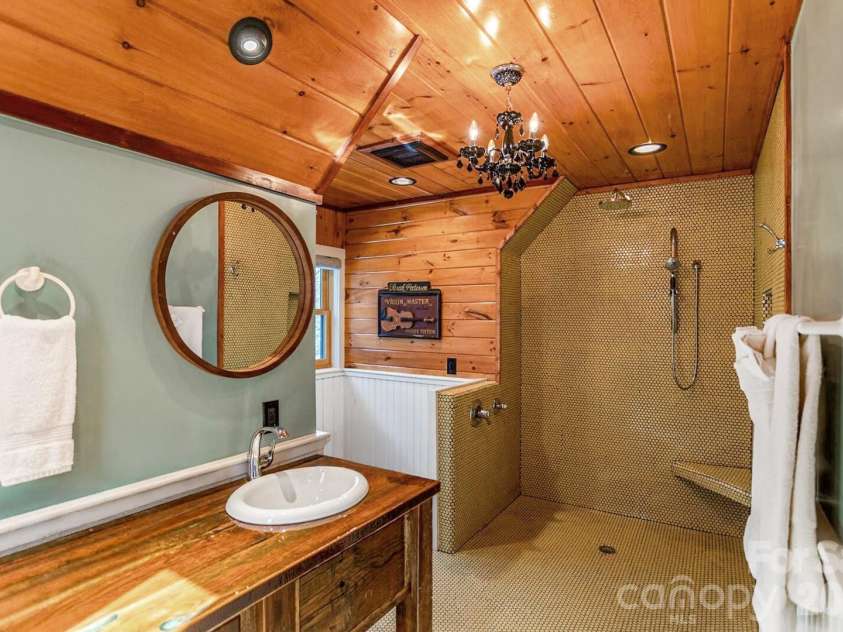 568 Auborn Trivette Road, Sugar Grove, NC 28679.  MLS# CAR4419786, YatesRealty ID 48028. Beautifully tiled shower.
