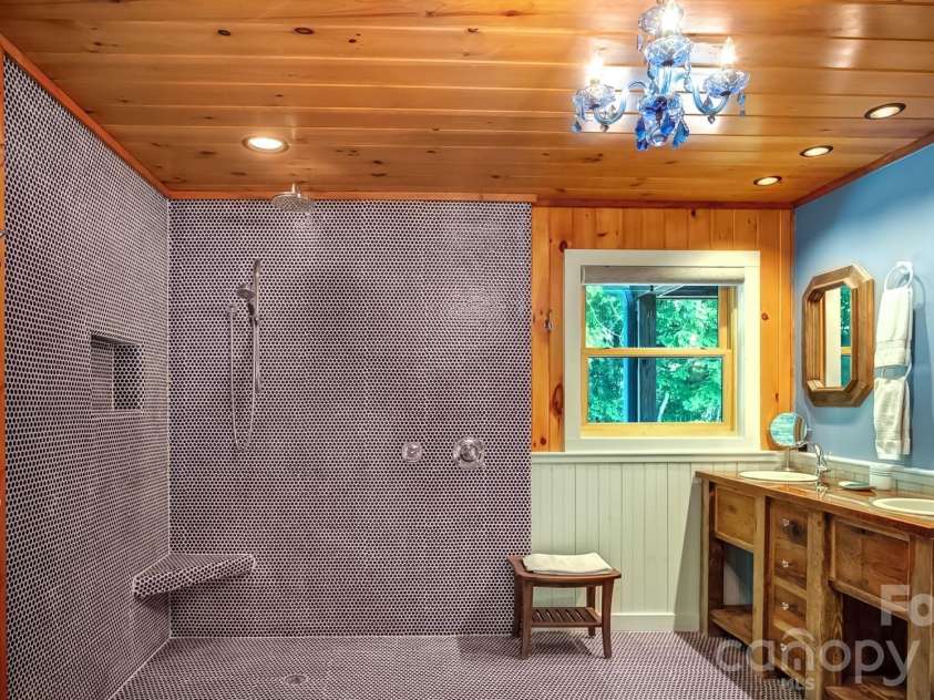568 Auborn Trivette Road, Sugar Grove, NC 28679.  MLS# CAR4419786, YatesRealty ID 48028. Gorgeous tiled shower and a double vanity.
