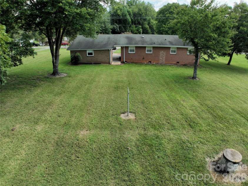 424 Bear Creek Road, Shelby, NC 28152.  MLS# CAR4419438, YatesRealty ID 48038. Easy to maintain flat yard. Well available for additional water.