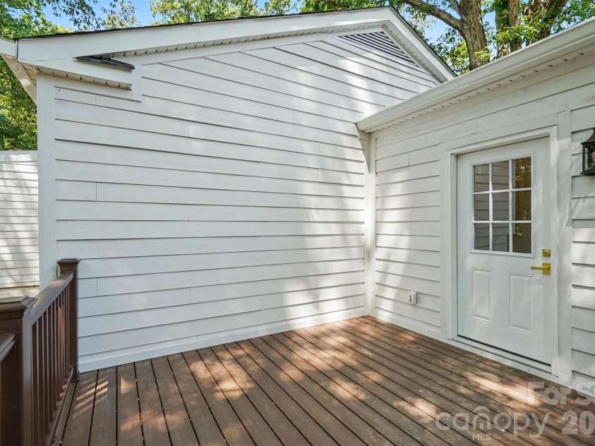 601 Marion Sims Drive, Lancaster, SC 29720.  MLS# CAR4404710, YatesRealty ID 48048. Cozy outdoor deck space offering fresh white siding, dark wood decking, and direct access inside, ideal for grilling or quiet morning coffee.
