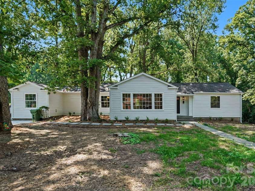 601 Marion Sims Drive, Lancaster, SC 29720.  MLS# CAR4404710, YatesRealty ID 48048. Updated 4BD/3BA ranch set back on a private, tree-lined lot featuring brand-new Hardie Siding, bright picture windows, and a spacious shaded front yard.