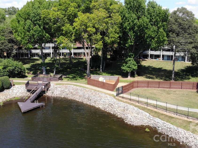 7615 Woods Lane, Cornelius, NC 28031.  MLS# CAR4419666, YatesRealty ID 48069. Day dock and condo buildings