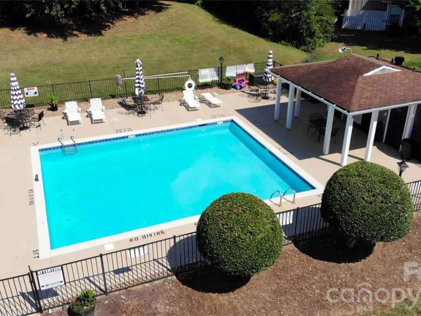 7615 Woods Lane, Cornelius, NC 28031.  MLS# CAR4419666, YatesRealty ID 48069. Refreshing pool and cabana area
