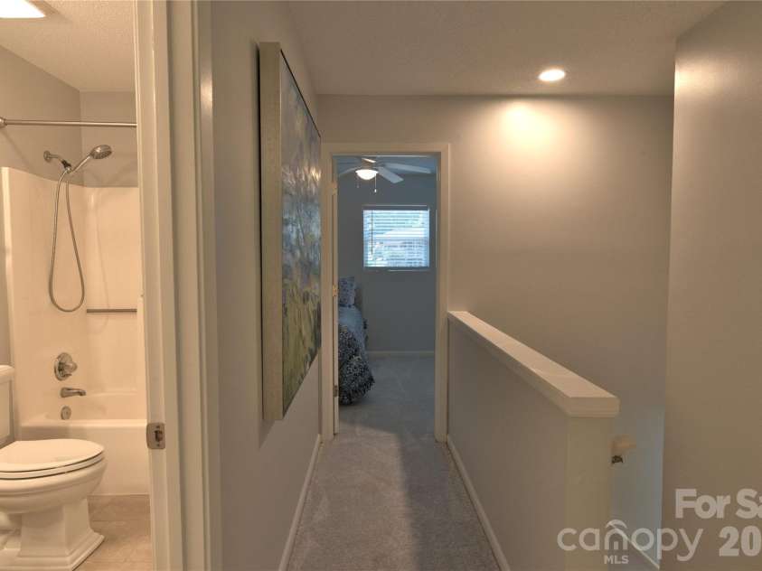 7615 Woods Lane, Cornelius, NC 28031.  MLS# CAR4419666, YatesRealty ID 48069. Upstairs hallway/bath