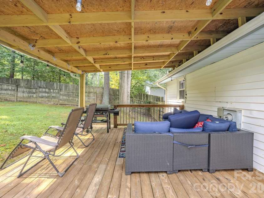 38 Ferenvilla Drive, Hendersonville, NC 28791.  MLS# CAR4416441, YatesRealty ID 48072. Covered rear deck