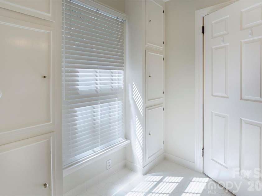 215 Bethel Drive, Salisbury, NC 28144.  MLS# CAR4419558, YatesRealty ID 48077. Ample storage throughout the primary bathroom.