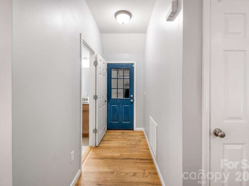 19 Oakcrest Place, Asheville, NC 28806.  MLS# CAR4408201, YatesRealty ID 48095. Hallway to garage & 1/2 bath on Main level