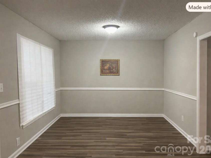 9206 Rotherham Lane, Charlotte, NC 28216.  MLS# CAR4419892, YatesRealty ID 48102. Empty Dining Area