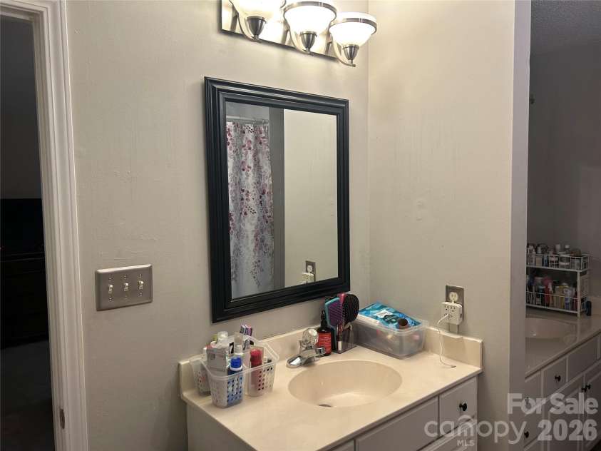 9206 Rotherham Lane, Charlotte, NC 28216.  MLS# CAR4419892, YatesRealty ID 48102. Primary bath with double separate vanities