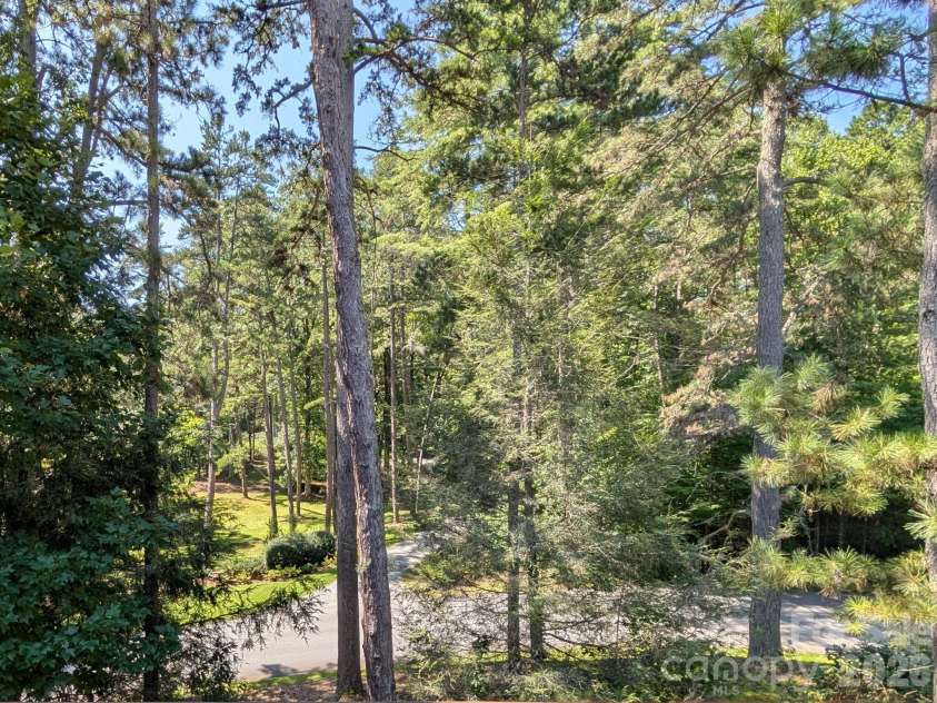 47 Ridgetop Circle, Brevard, NC 28712.  MLS# CAR4414637, YatesRealty ID 48104. Covered Back Deck View