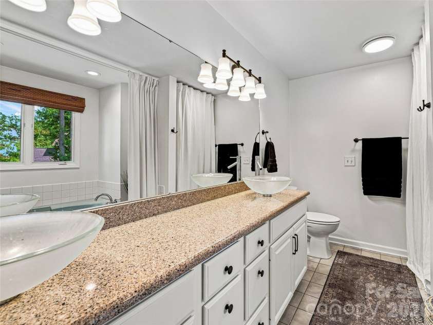 41 Forest Knoll Drive, Weaverville, NC 28787.  MLS# CAR4419379, YatesRealty ID 48108. Main level primary bath.