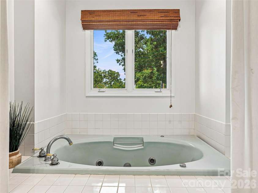 41 Forest Knoll Drive, Weaverville, NC 28787.  MLS# CAR4419379, YatesRealty ID 48108. Main level primary bath.