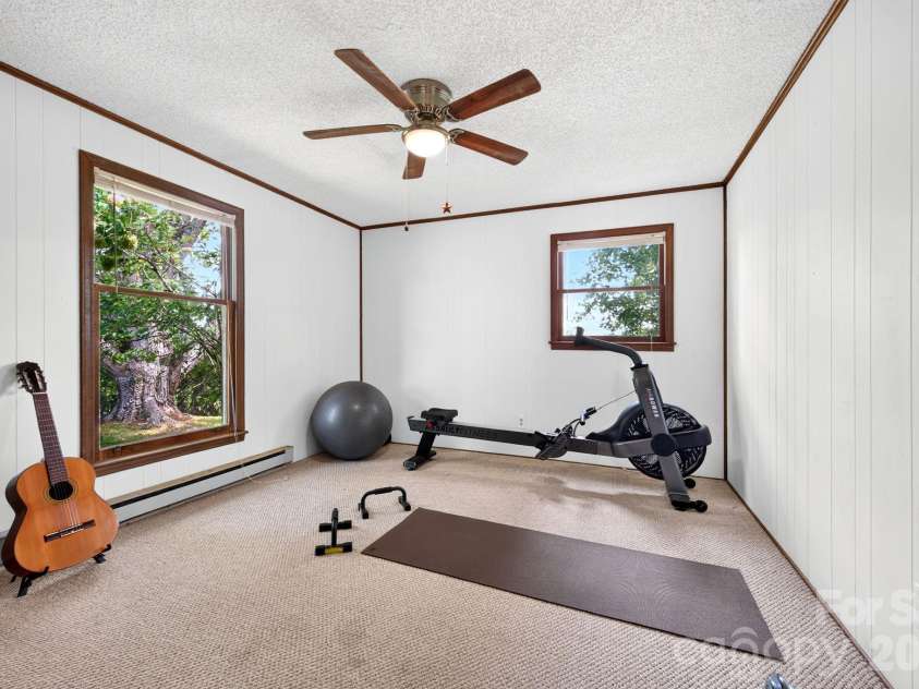 1057 Skyway Drive, Marshall, NC 28753.  MLS# CAR4418857, YatesRealty ID 48112. 2nd bedroom has a ceiling fan and big windows