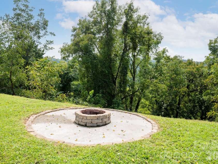 1057 Skyway Drive, Marshall, NC 28753.  MLS# CAR4418857, YatesRealty ID 48112. Dedicated fire pit area for evenings outside
