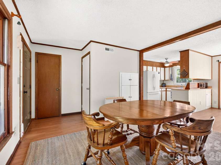 1057 Skyway Drive, Marshall, NC 28753.  MLS# CAR4418857, YatesRealty ID 48112. Dining area conveniently connected to the kitchen