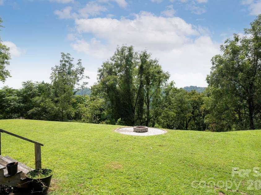 1057 Skyway Drive, Marshall, NC 28753.  MLS# CAR4418857, YatesRealty ID 48112. Level yard is private and has long range views