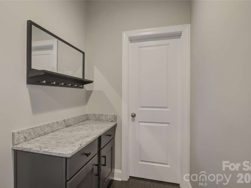14219 Twin Eagles Lane, Charlotte, NC 28278.  MLS# CAR4418745, YatesRealty ID 48122. Spacious and elegant butler's pantry featuring premium storage