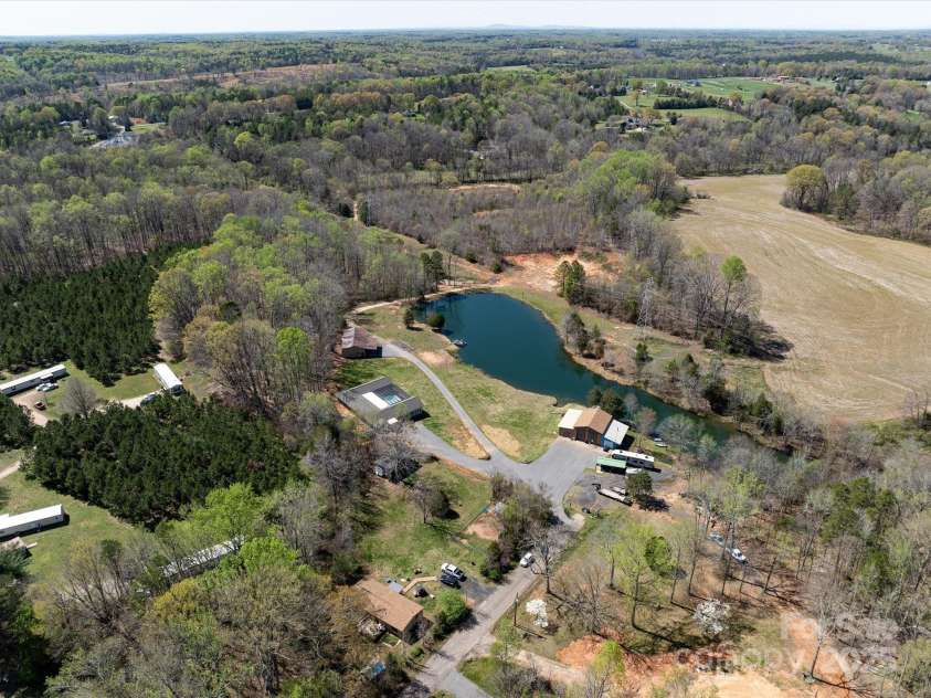 7545 Brancy Street, Kannapolis, NC 28081.  MLS# CAR4242395, YatesRealty ID 4813. 21.71 Acre Retreat with Private Pond, race track, multiple garages , sheds and a workshop!