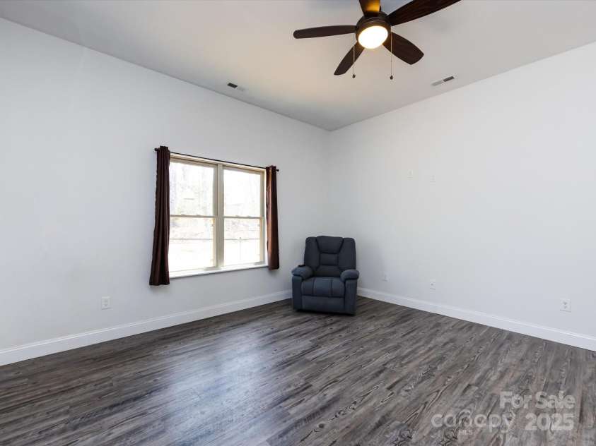 7545 Brancy Street, Kannapolis, NC 28081.  MLS# CAR4242395, YatesRealty ID 4813. 2nd Bedroom with vinyl plank flooring, ceiling light/fan , walk in closet and jack & jill bathroom with private wet closet.