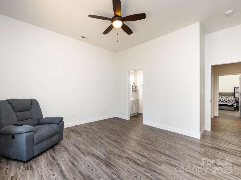 7545 Brancy Street, Kannapolis, NC 28081.  MLS# CAR4242395, YatesRealty ID 4813. 2nd Bedroom with vinyl plank flooring, ceiling light/fan , walk in closet and jack & jill bathroom with private wet closet.