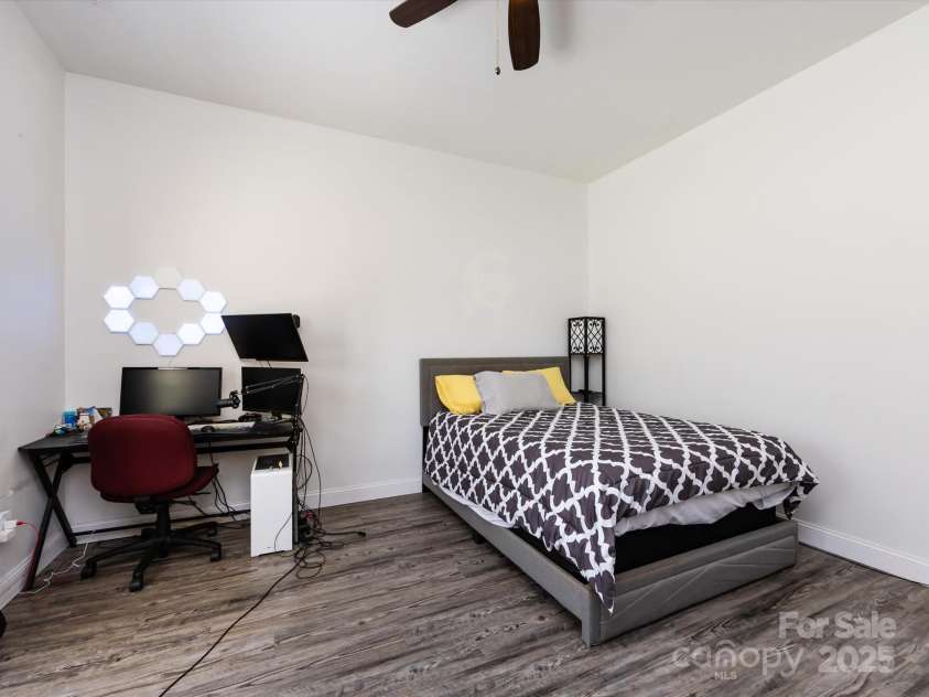 7545 Brancy Street, Kannapolis, NC 28081.  MLS# CAR4242395, YatesRealty ID 4813. 3nd Bedroom with vinyl plank flooring, ceiling light/fan , walk in closet and jack & jill bathroom with private wet closet.