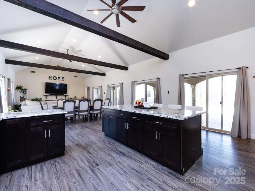 7545 Brancy Street, Kannapolis, NC 28081.  MLS# CAR4242395, YatesRealty ID 4813. Stunning Kitchen boasting an open floor plan , walk in pantry, exotic granite countertops, huge breakfast bar, tiled backsplash, stainless steel appliances, large sink and tons of cabinets with accent lighting. The kitc