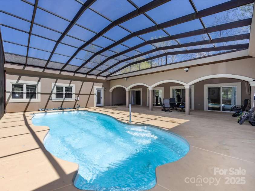 7545 Brancy Street, Kannapolis, NC 28081.  MLS# CAR4242395, YatesRealty ID 4813. Stunning screened in Lanai and Inground Pool