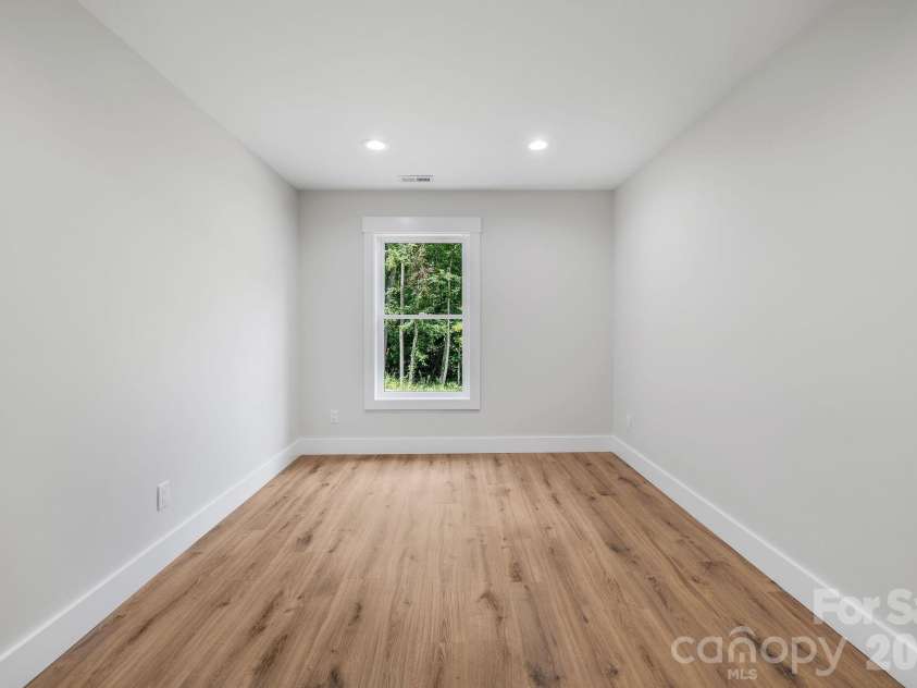 447 Blooming Laurel Drive, Hendersonville, NC 28792.  MLS# CAR4416283, YatesRealty ID 48140. Lower Level Office Space/Flex Room
