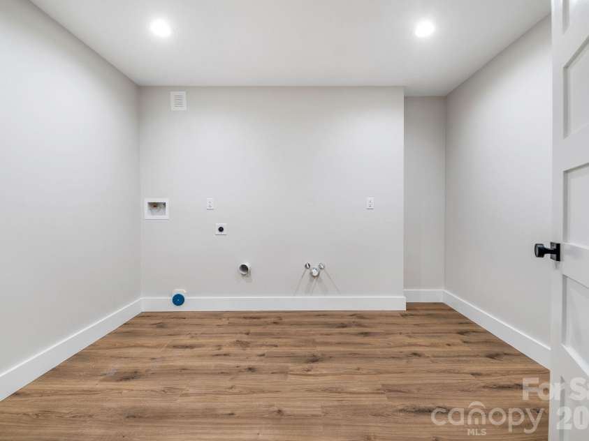 447 Blooming Laurel Drive, Hendersonville, NC 28792.  MLS# CAR4416283, YatesRealty ID 48140. Lower Level Second Laundry Room