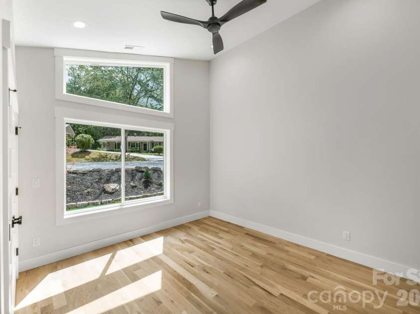 447 Blooming Laurel Drive, Hendersonville, NC 28792.  MLS# CAR4416283, YatesRealty ID 48140. Second Main Floor Bedroom with Vaulted Ceiling