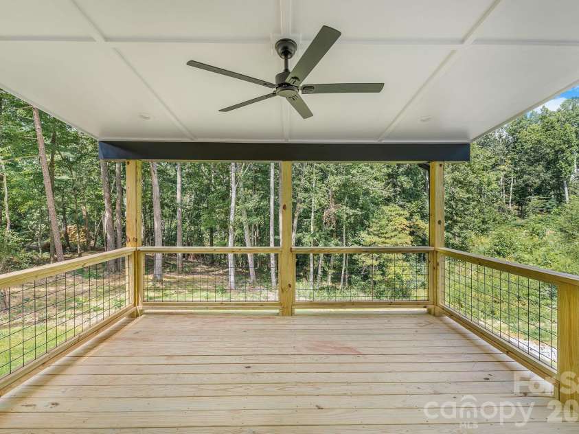 447 Blooming Laurel Drive, Hendersonville, NC 28792.  MLS# CAR4416283, YatesRealty ID 48140. Spacious Covered Back Deck with Stair Access to Backyard