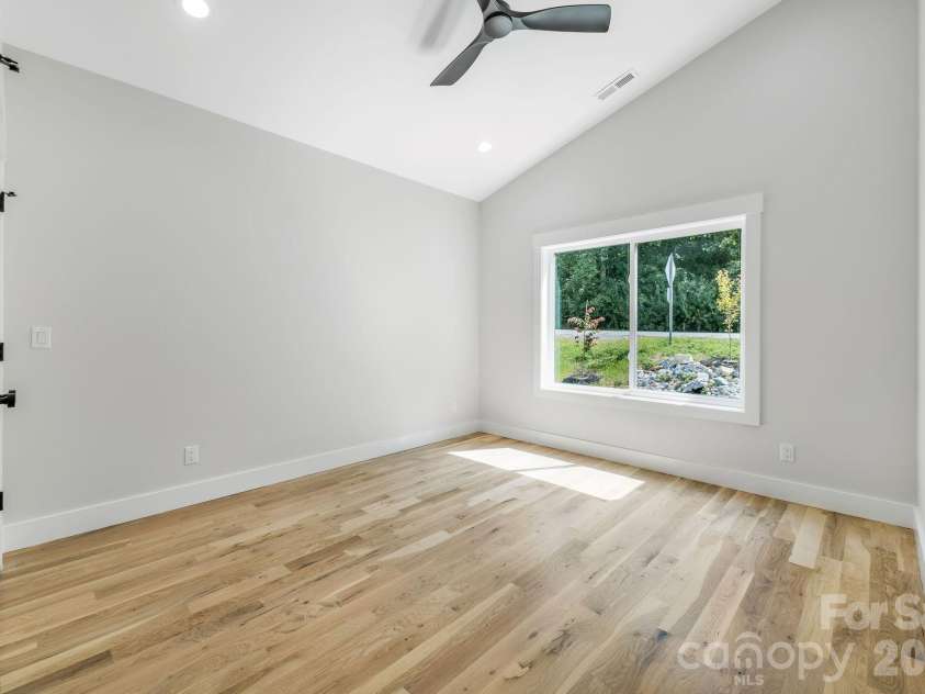 447 Blooming Laurel Drive, Hendersonville, NC 28792.  MLS# CAR4416283, YatesRealty ID 48140. Third Main Floor Bedroom with Vaulted Ceiling