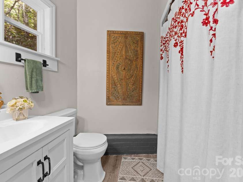 103 Riverwood Drive, Sylva, NC 28779.  MLS# CAR4420195, YatesRealty ID 48144. Bathroom off Primary Bedroom