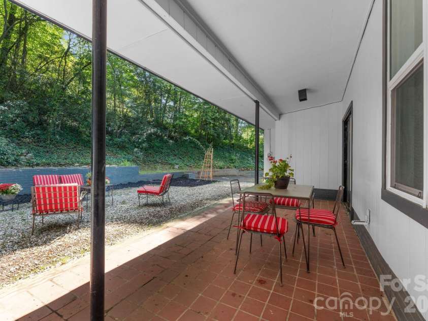 103 Riverwood Drive, Sylva, NC 28779.  MLS# CAR4420195, YatesRealty ID 48144. Covered Patio toward Courtyard Patio