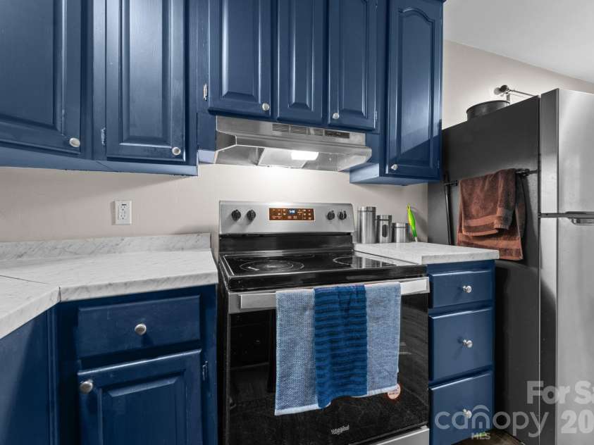 103 Riverwood Drive, Sylva, NC 28779.  MLS# CAR4420195, YatesRealty ID 48144. Freshly Painted Kitchen