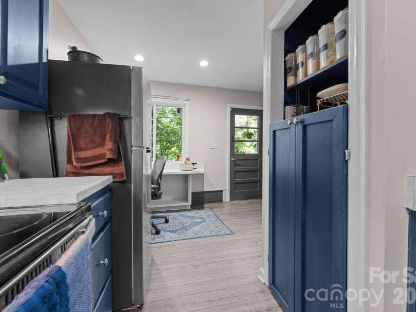 103 Riverwood Drive, Sylva, NC 28779.  MLS# CAR4420195, YatesRealty ID 48144. Kitchen view toward office nook