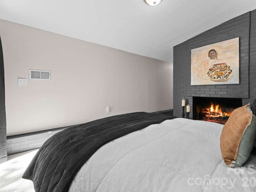 103 Riverwood Drive, Sylva, NC 28779.  MLS# CAR4420195, YatesRealty ID 48144. Primary Bedroom with Fireplace