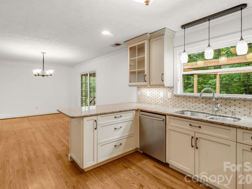 129 Whisperwood Drive, Hendersonville, NC 28791.  MLS# CAR4419413, YatesRealty ID 48149. 