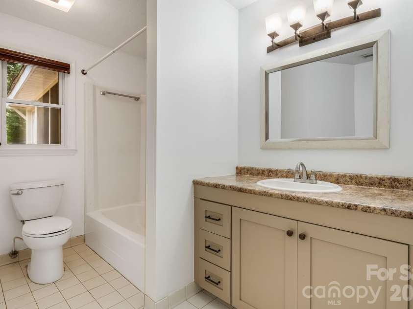 129 Whisperwood Drive, Hendersonville, NC 28791.  MLS# CAR4419413, YatesRealty ID 48149. 