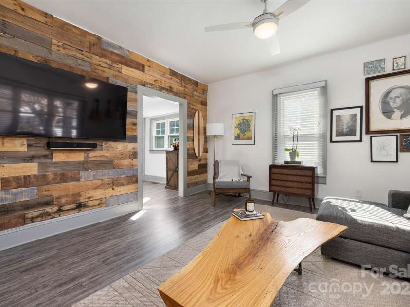 506 Campus Street, Charlotte, NC 28216.  MLS# CAR4217971, YatesRealty ID 4816. Custom reclaimed wood panelling in Living!