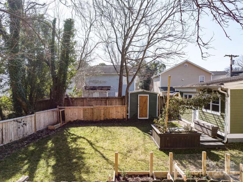506 Campus Street, Charlotte, NC 28216.  MLS# CAR4217971, YatesRealty ID 4816. Rear fenced in yard- shed, rear deck, fire pit area!
