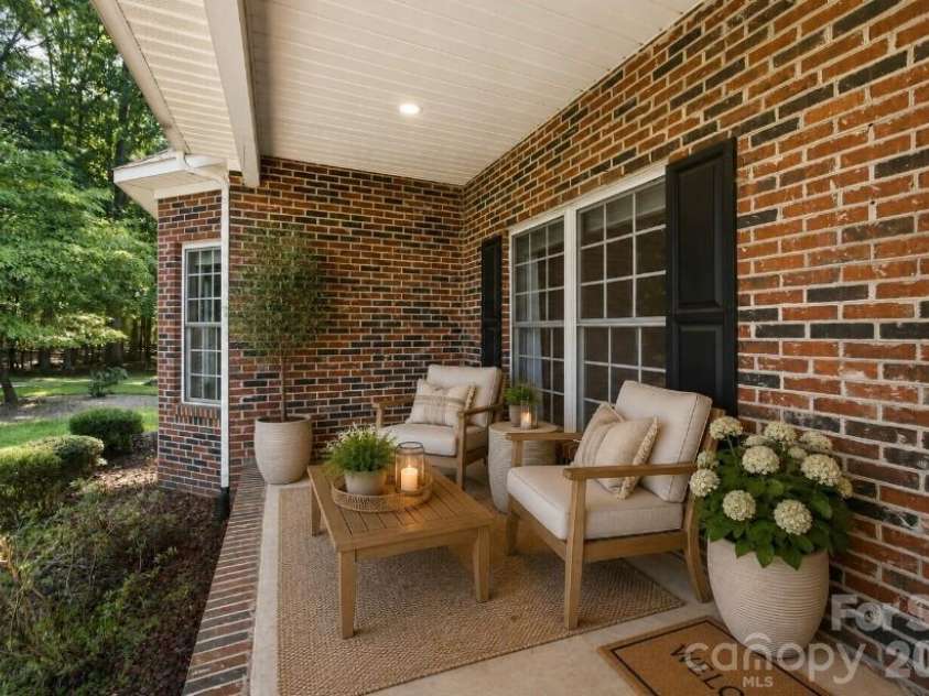 216 Minnie Queen Lane, Belmont, NC 28012.  MLS# CAR4418325, YatesRealty ID 48162. Covered Front Porch - Virtual Staging