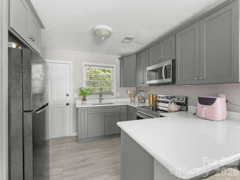 71 Harvey Osteen Road, Zirconia, NC 28790.  MLS# CAR4418072, YatesRealty ID 48166. Unit 1 Kitchen