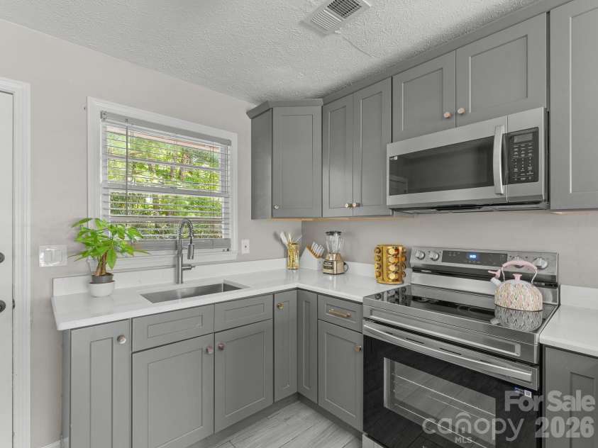 71 Harvey Osteen Road, Zirconia, NC 28790.  MLS# CAR4418072, YatesRealty ID 48166. Unit 1 Kitchen