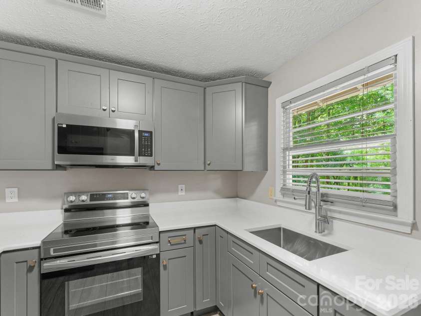 71 Harvey Osteen Road, Zirconia, NC 28790.  MLS# CAR4418072, YatesRealty ID 48166. Unit 2 Kitchen all new!