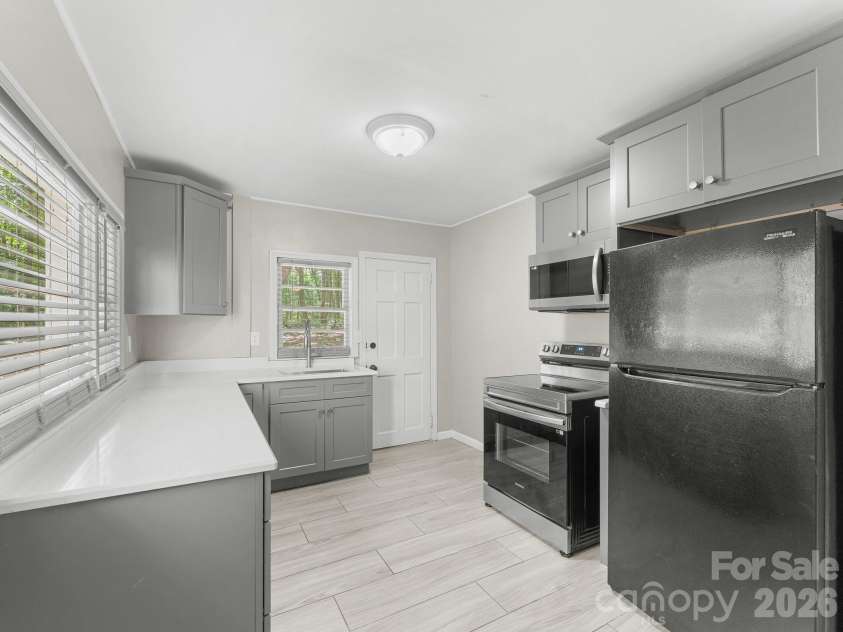 71 Harvey Osteen Road, Zirconia, NC 28790.  MLS# CAR4418072, YatesRealty ID 48166. Unit 3 Kitchen