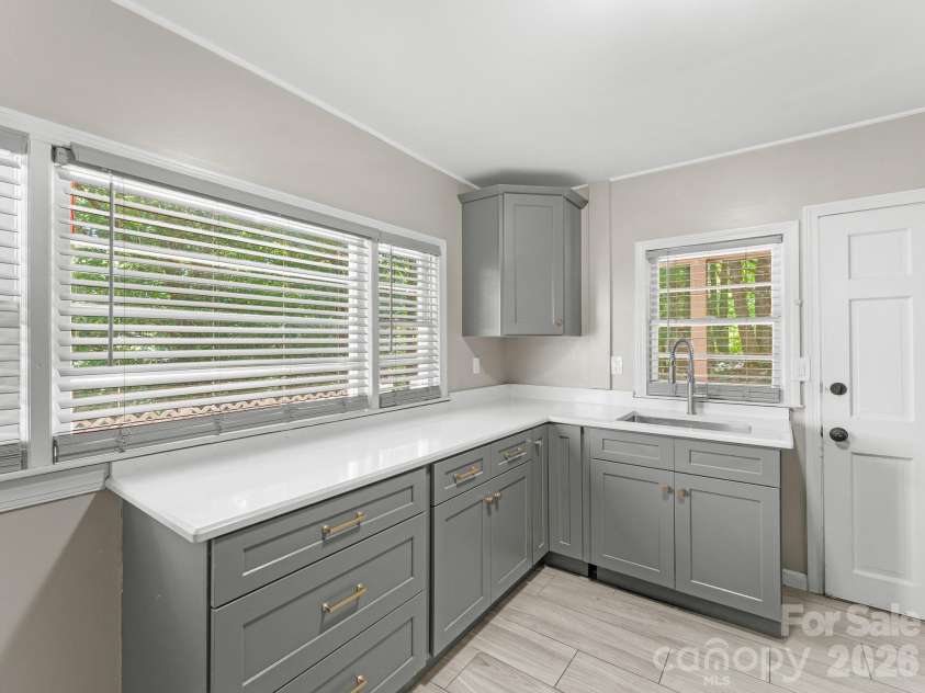 71 Harvey Osteen Road, Zirconia, NC 28790.  MLS# CAR4418072, YatesRealty ID 48166. Unit 3 Kitchen